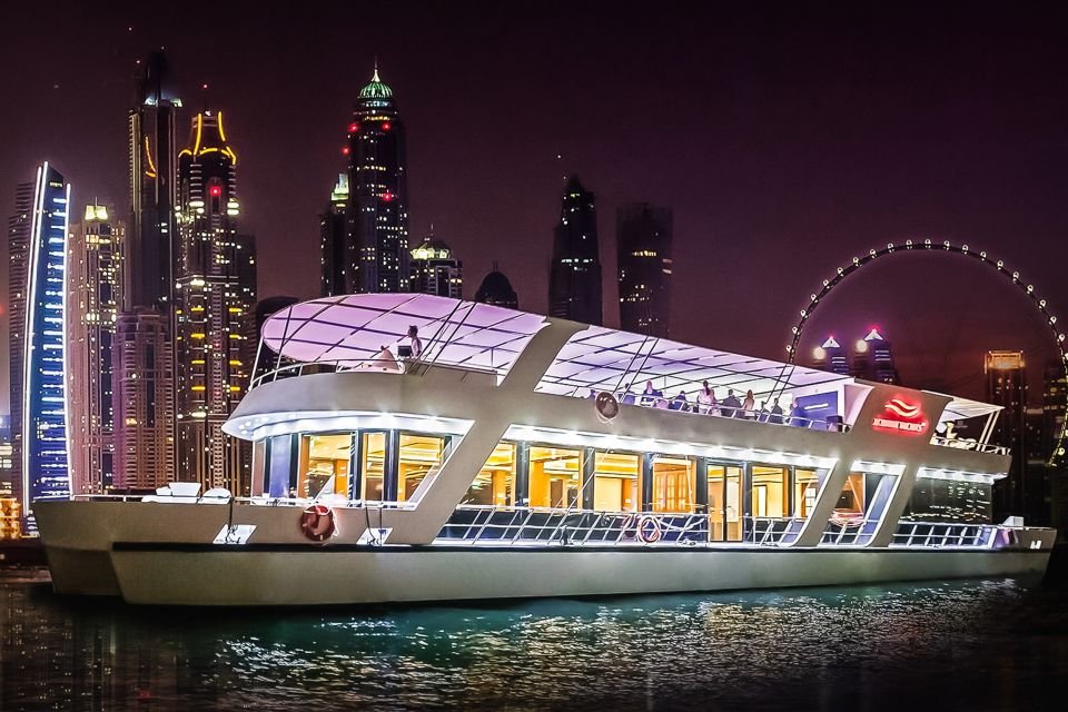 Dubai Marina Cruise boat featuring a large window, set against city skyline.