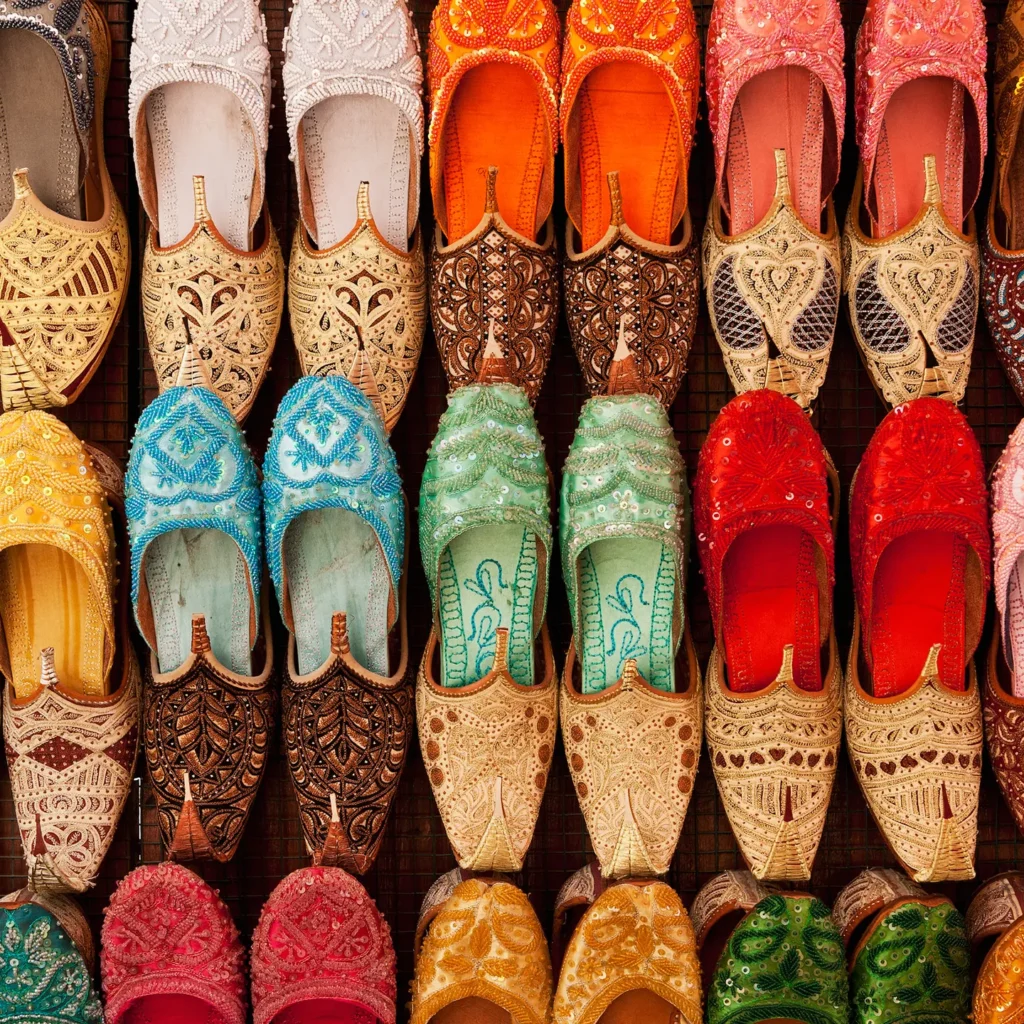 Colorful shoes on display at  market in Dubai's Textile Souk.