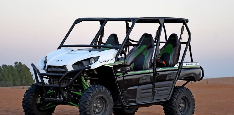 Black and white dune parked in the Dubai desert.