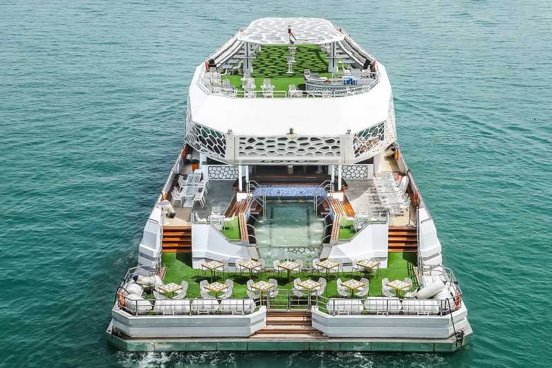 Image of a luxurious yacht featuring a large deck and a pool, ideal for a cruise dinner