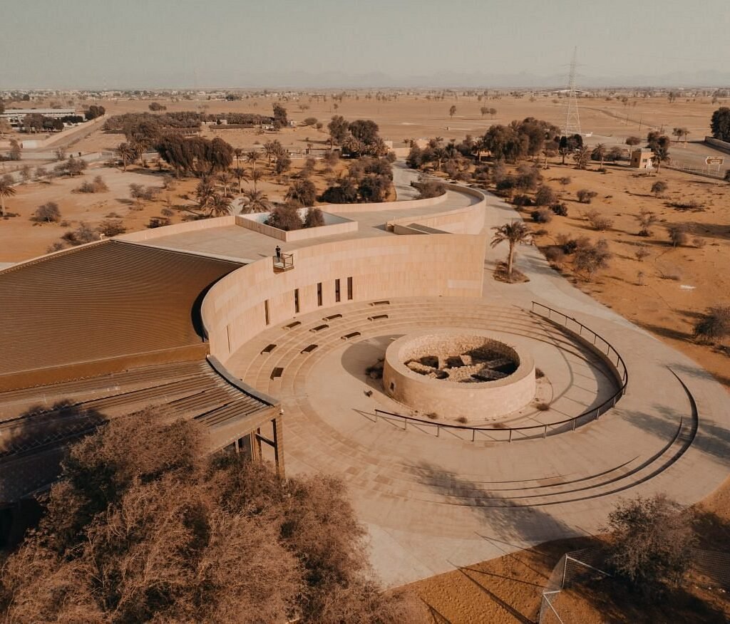 Circular building in desert at Mleiha Archaeological center from above.