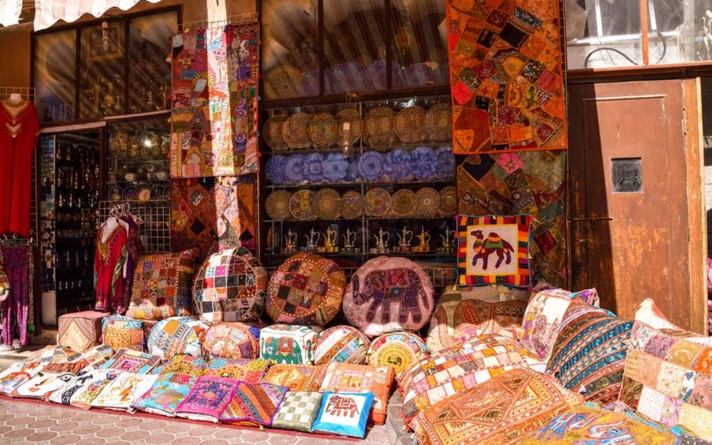 Vibrant assortment of pillows and items at old souk Dubai.