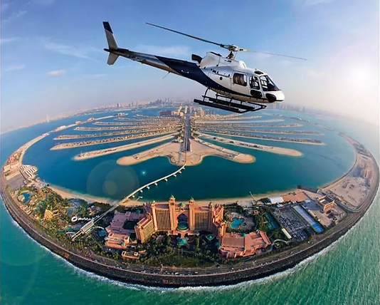 alm Jumeirah Helicopter Tour: helicopter flying over the iconic Palm Islands.