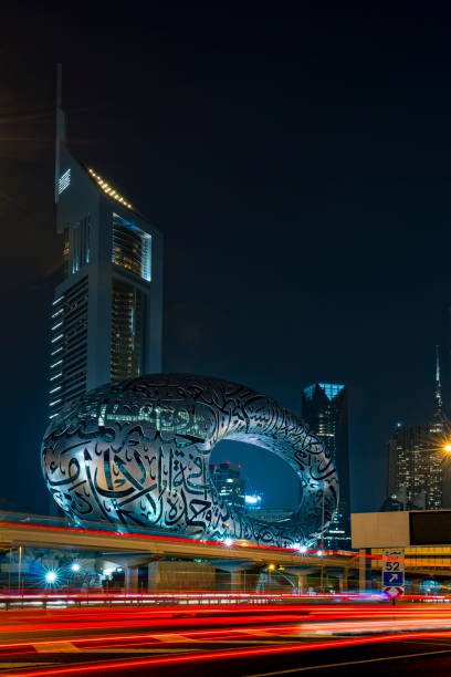 Dubai, UAE, 18 November 2020: The Museum of the Future Dubai at night with light trails. The iconic building of Dubai. To be ready for the 2020 universal exhibition with Arabic poetry on its exterior.