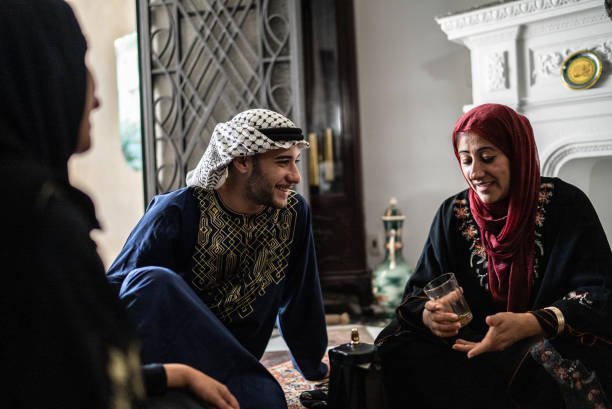 Arab family having tea together at home