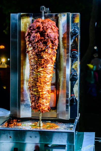 Arabic shawarma meat preparing on skewer