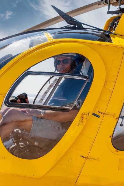 helicopter Arab pilot, flying a rescue chopper, wearing helmet and headset