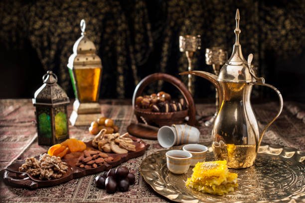 Traditional Arabian coffee, nuts and sweets served to guest at majlis