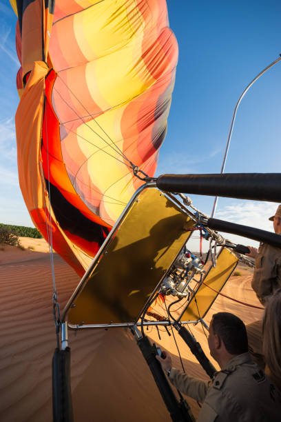 Dubai, United Arab Emirates - November 9, 2016. Hot air balloon is being deflated after successful landing. This photograph was taken in early morning with full frame camera and Zeiss wide-angle lens.